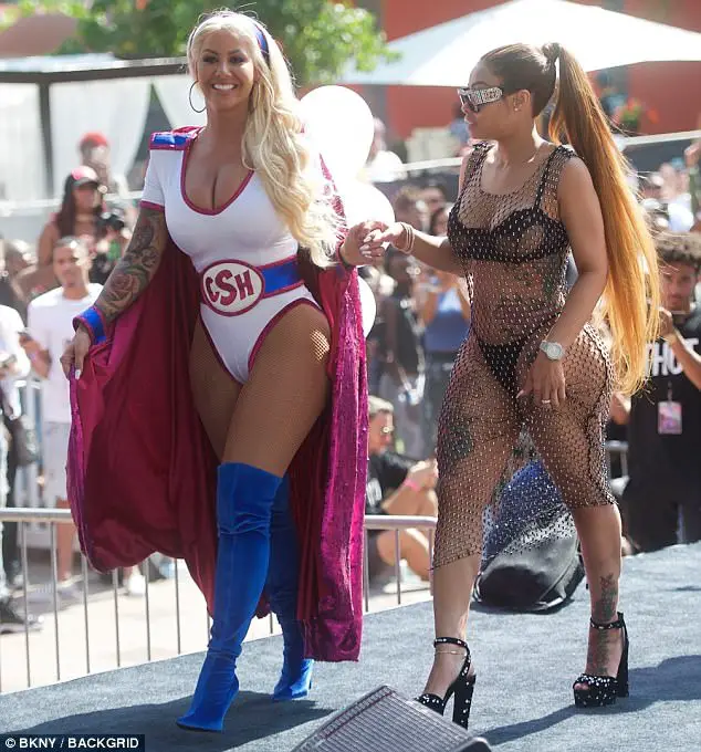 Amber Rose Dons Platinum Wig And Superhero Costume For Third Annual Sl*tWalk