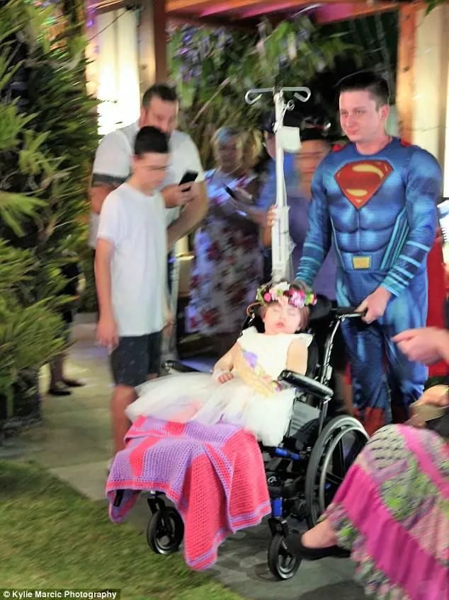 Terminally Ill Four-Year-Old Given A Week To Live Is Wheeled Down The Aisle As Flower Girl At Her Parents Wedding 