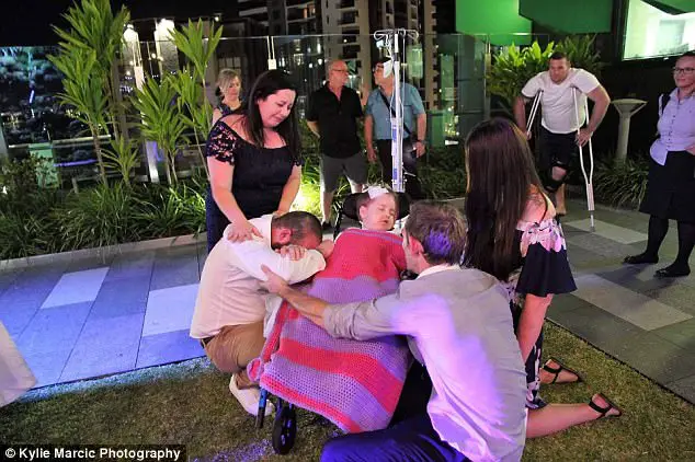 Terminally Ill Four-Year-Old Given A Week To Live Is Wheeled Down The Aisle As Flower Girl At Her Parents Wedding 