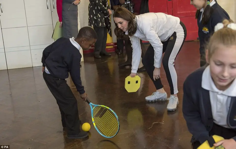 Adorable Moment Schoolchildren Line Up To Shake The Duchess' Hand - Then Go In For Bear Hugs Instead
