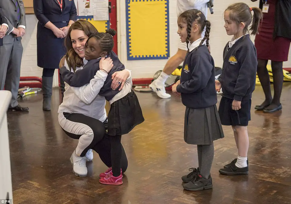 Adorable Moment Schoolchildren Line Up To Shake The Duchess' Hand - Then Go In For Bear Hugs Instead