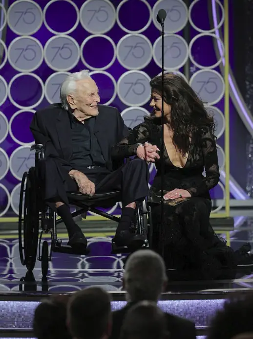 Hollywood legend Kirk Douglas, 101, gets a standing ovation as he steals the show with Catherine Zeta Jones at Golden Globes