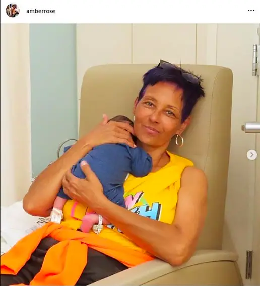 Amber Rose Shares Snaps Of Her Parents Holding Her Newborn Son Slash