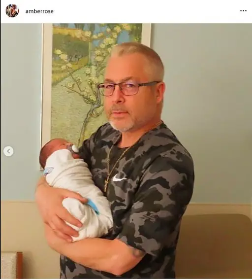 Amber Rose Shares Snaps Of Her Parents Holding Her Newborn Son Slash