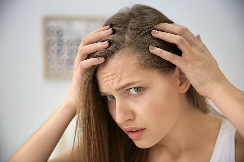 Hair Loss in Women: Causes & At Home Treatment Options
