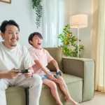 Father and son playing video games.